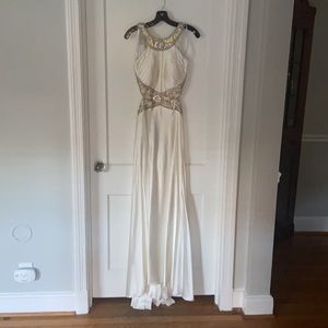 Gorgeous Grecian white gown with a high neck and cut outs in rib cage area